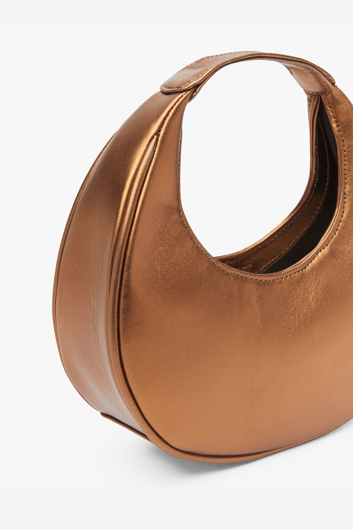Bolso Eclipse Cobre de Lady Pipa para completar looks de invitada.