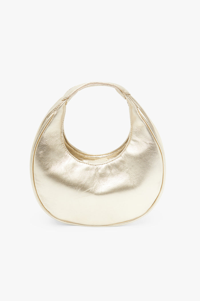 Bolso Eclipse Dorado de Lady Pipa para completar looks de invitada.