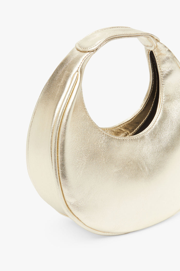 Bolso Eclipse Dorado de Lady Pipa para completar looks de invitada.