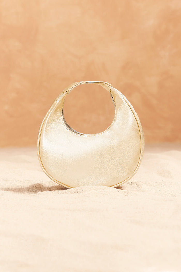 Bolso Eclipse Dorado de Lady Pipa para completar looks de invitada.