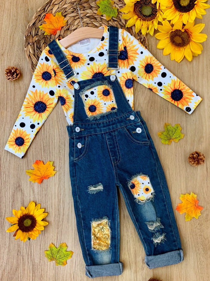 Girls fall long-sleeved sunflower print top and sequin patched denim overalls with adjustable shoulder straps and cuffed hems - Mia Belle Girls