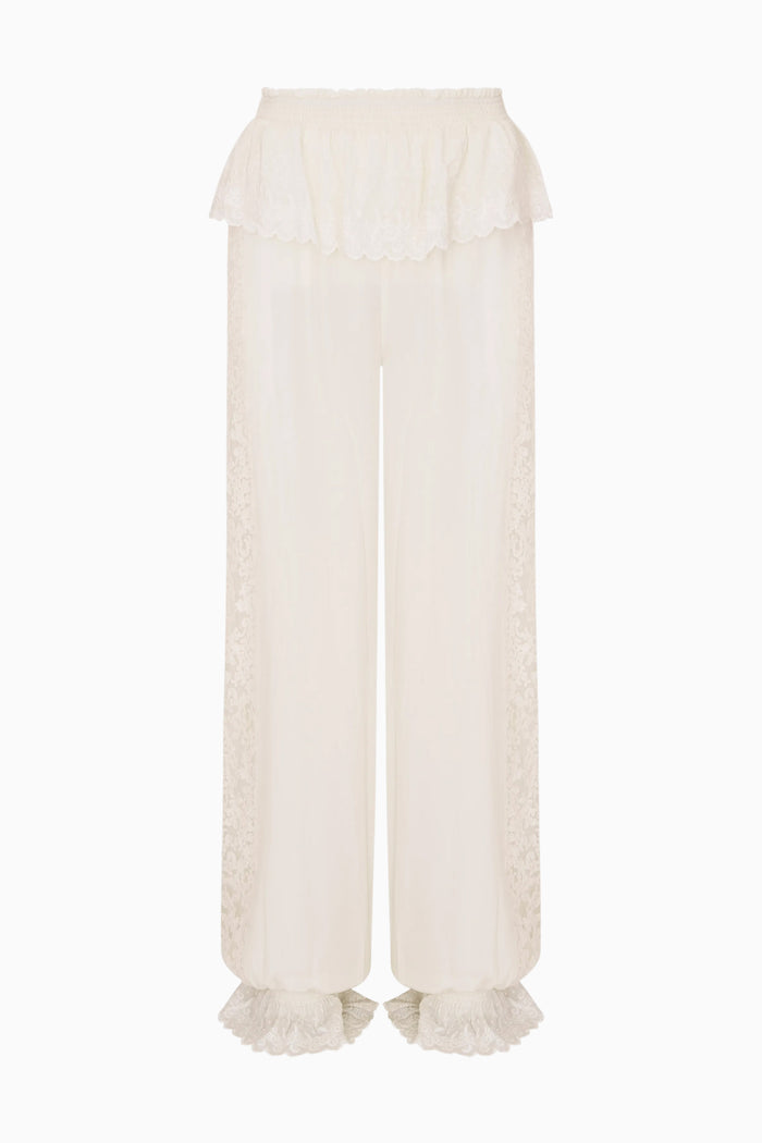 White pants with ruffled cuffs on a white background