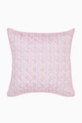 Pink floral quilted pillow on a white background