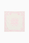 Pink and white patterned square scarf on a white background