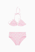 Pink bikini set with lattice bow pattern on a white background