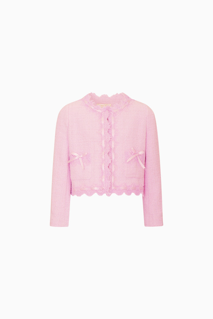 Pink cardigan with scalloped edges on a white background
