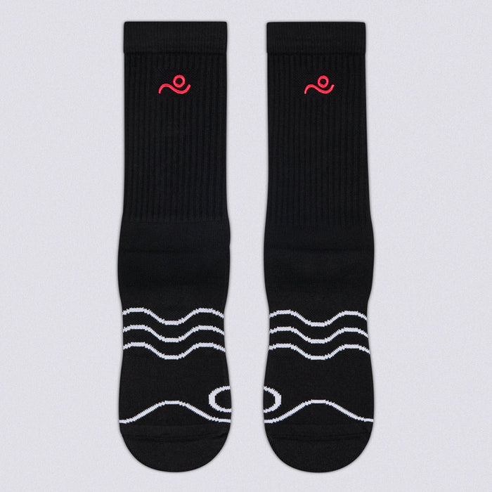 A pair of black crew socks with white wavy line patterns on the toes and a small red embroidered logo near the cuff, displayed flat against a light gray background.
