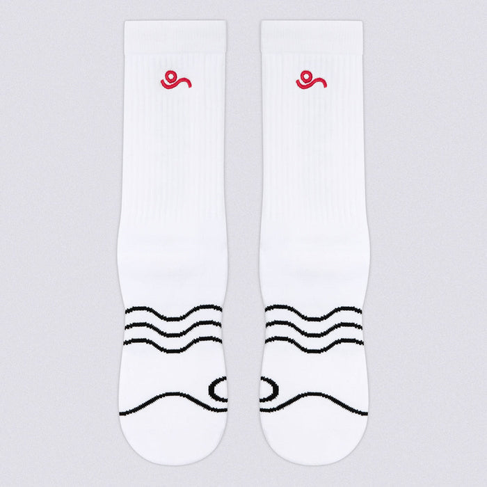 A pair of white crew socks with a small red spiral logo near the cuff and black wavy line graphics across the foot, shown on a light gray background.