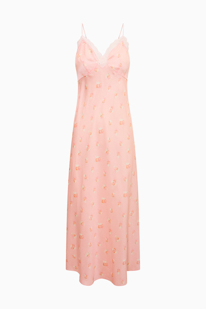 Pink slip dress with floral pattern on a white background