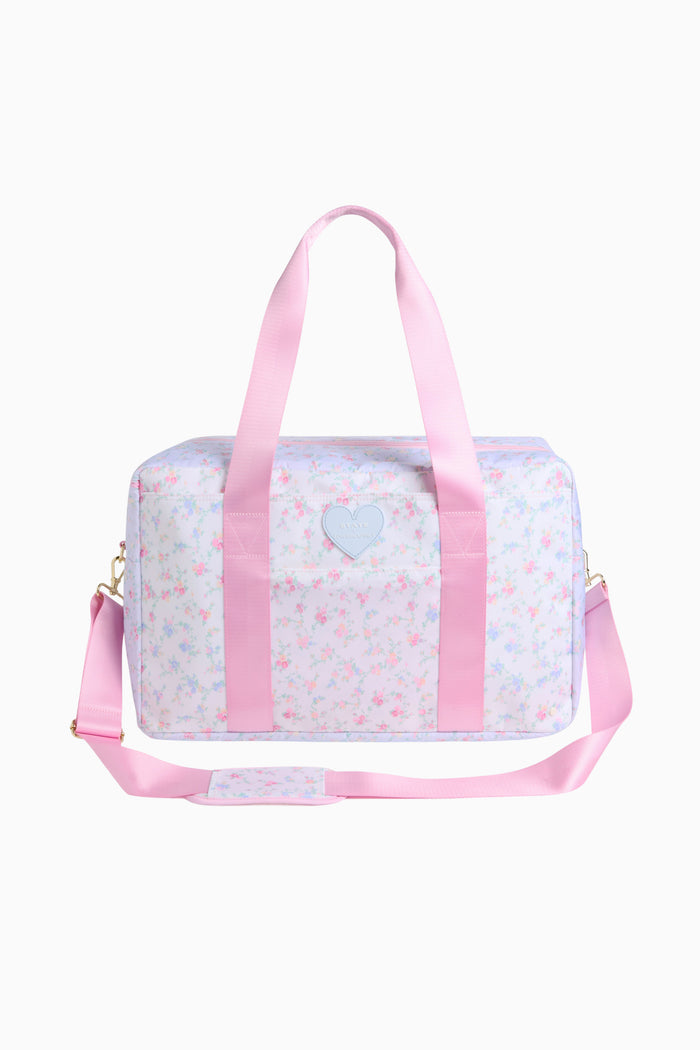 Pink and white duffel bag with heart design on a white background