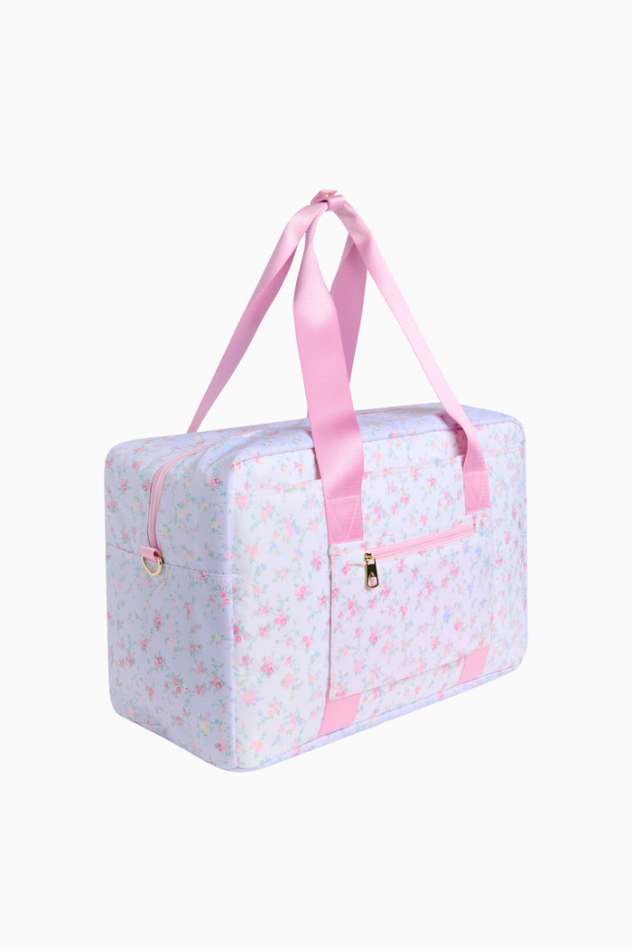 Light blue travel bag with pink accents on a white background