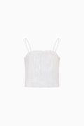 White lace camisole against a white background.