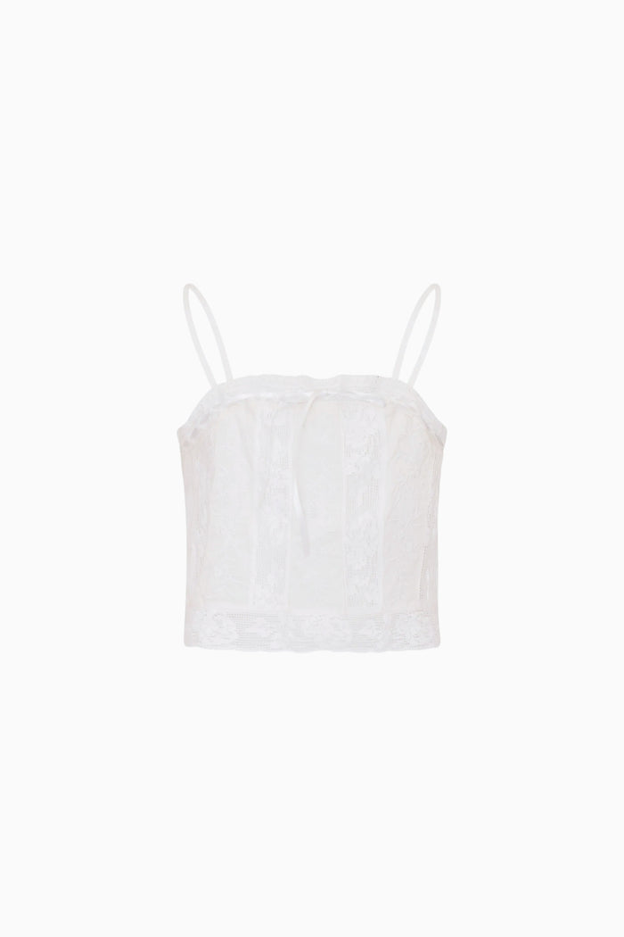 White lace camisole against a white background.