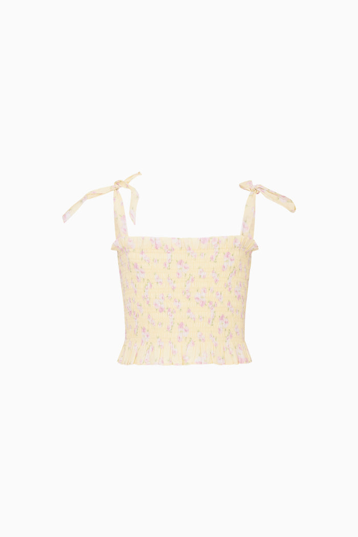 Yellow floral top on a white background